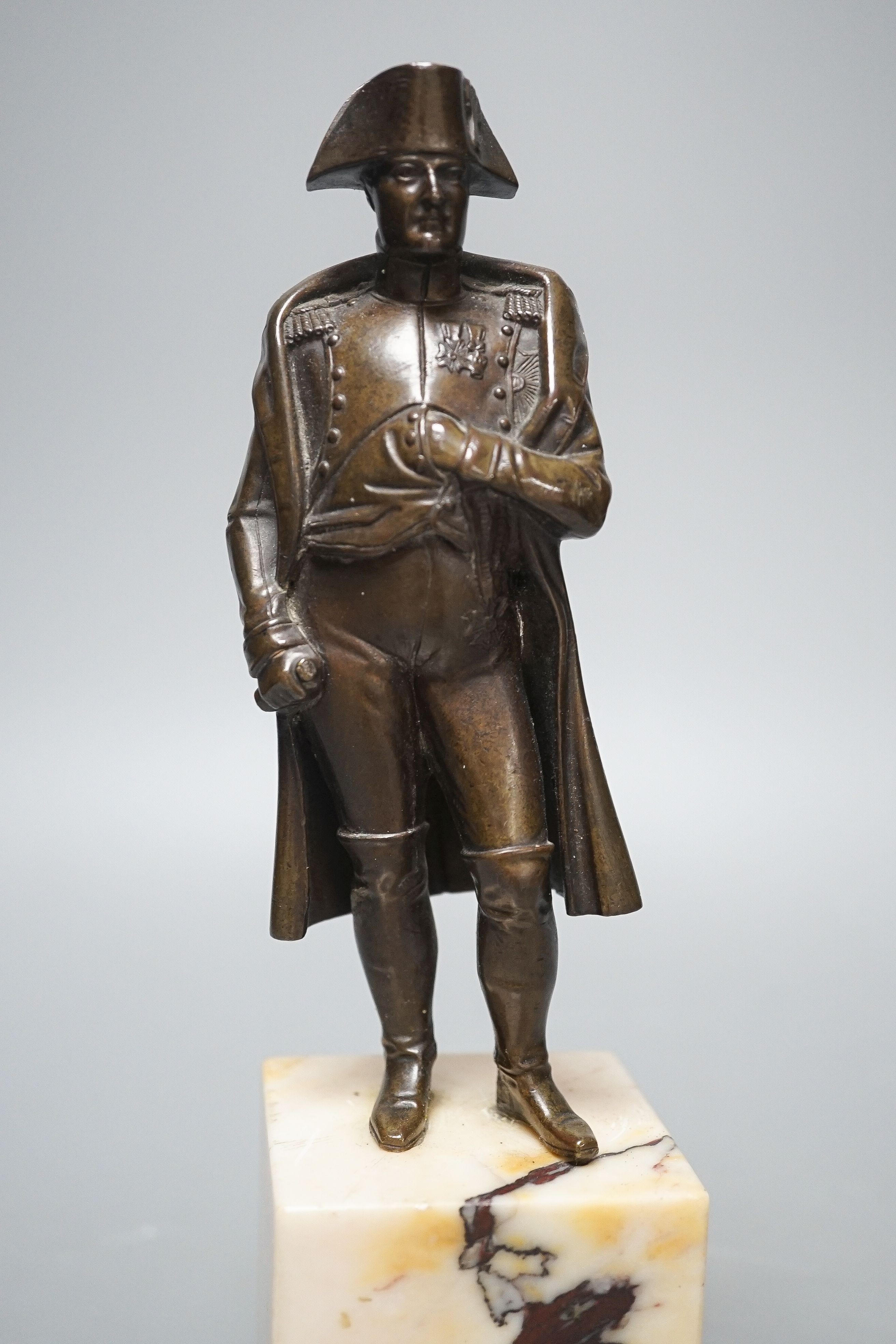 A bronze figure of Napoleon on marble base and two related prints ‘Porto Ferrajo’ and ‘Grand Entry of the Allied Sovereigns into Paris’ bronze 24cm tall
